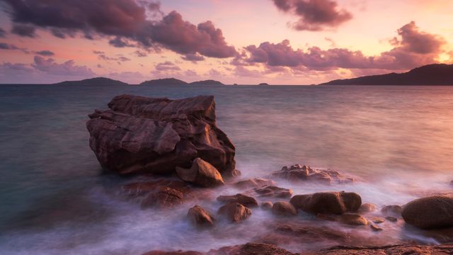 Waves on granite boulders, Anse Patates Beach, La Digue, Seychelles