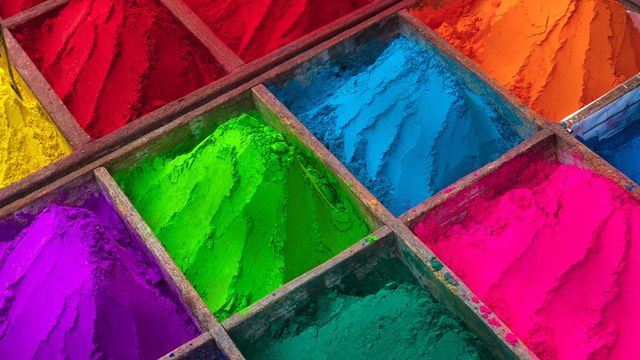 Brightly colored powder for sale during Holi