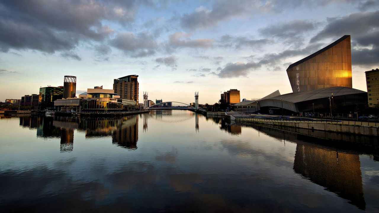 The Lowry Theatre and Imperial War Museum North, with reflections at Salford Quays, Greater Manchester