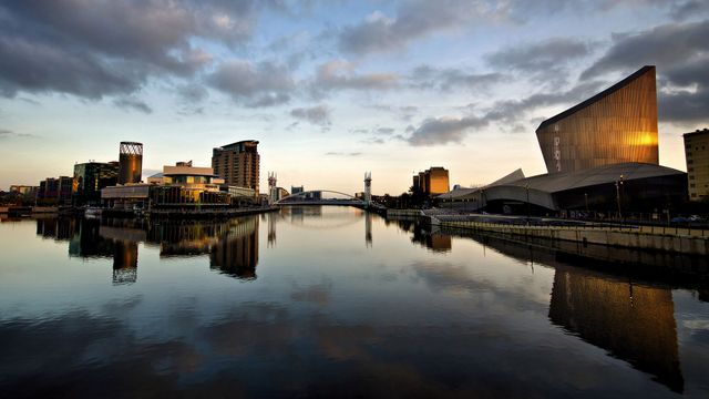 The Lowry Theatre and Imperial War Museum North, with reflections at Salford Quays, Greater Manchester