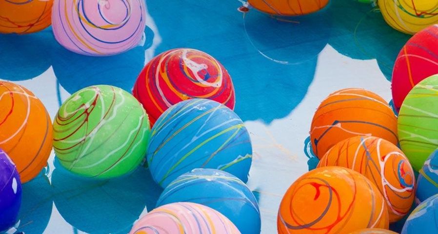 Yo-yo tsuri water balloons in the pool at a neighborhood festival in Japan