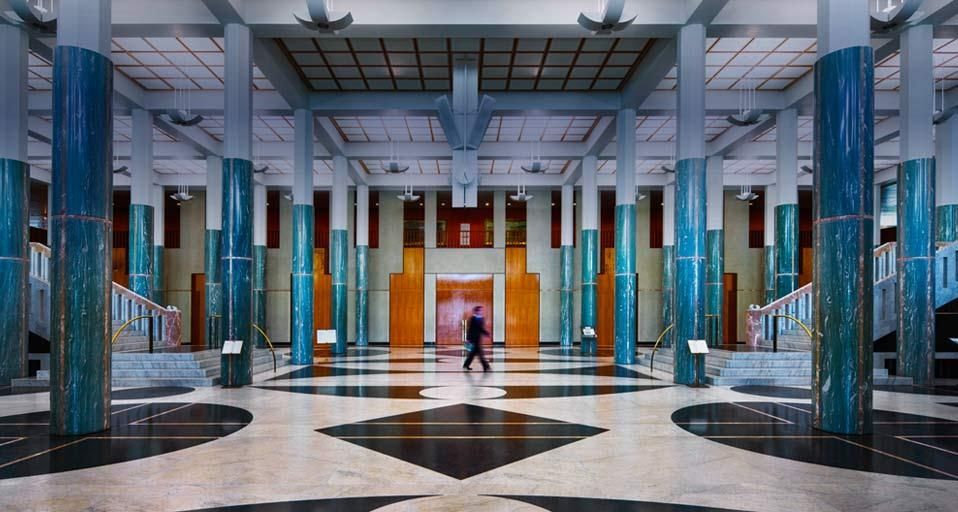 Man walking through the main foyer in the New Parliament House