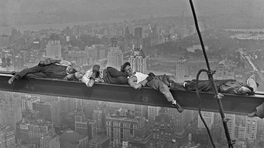Happy Labor Day. Construction workers rest above 1930s Manhattan.