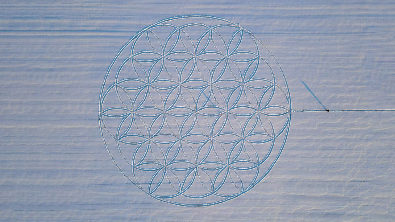 The Flower of Life symbol drawn in the snow by artist Michael Uy, Jacobsdorf, Brandenburg, Germany