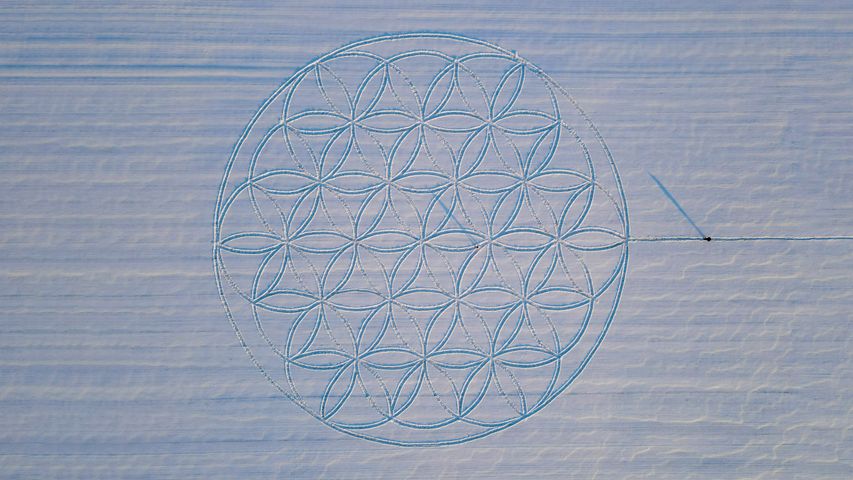 The Flower of Life symbol drawn in the snow by artist Michael Uy, Jacobsdorf, Brandenburg, Germany