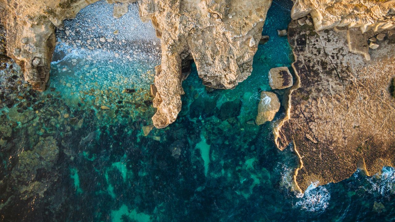 Rocky coastline turquoise sea caves