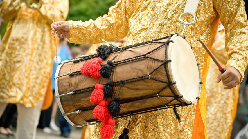 Musician playing a traditional Indian dhol
