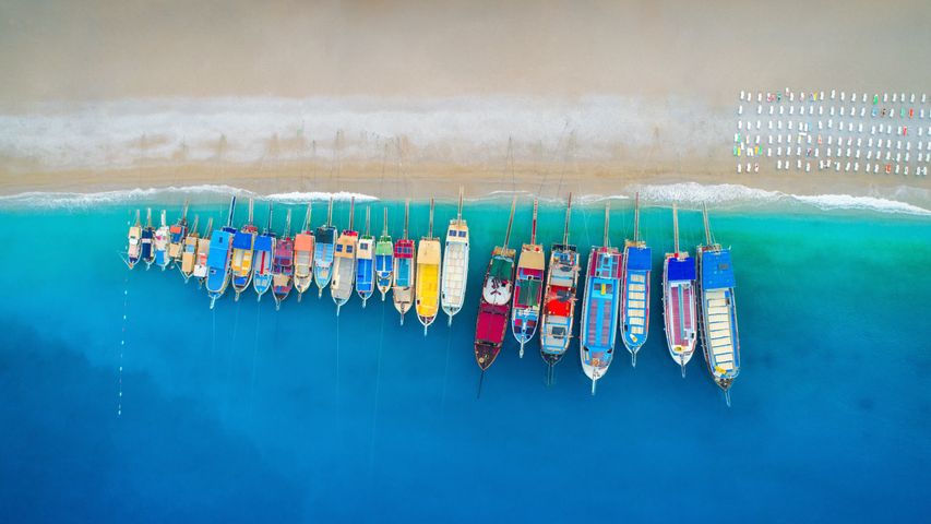 Aerial view of colorful boats in the Mediterranean Sea in Ölüdeniz, Turkey