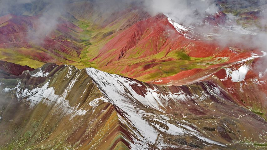 Aerial view of snowy peaks of Vinicunca (aka Rainbow Mountain), Peru