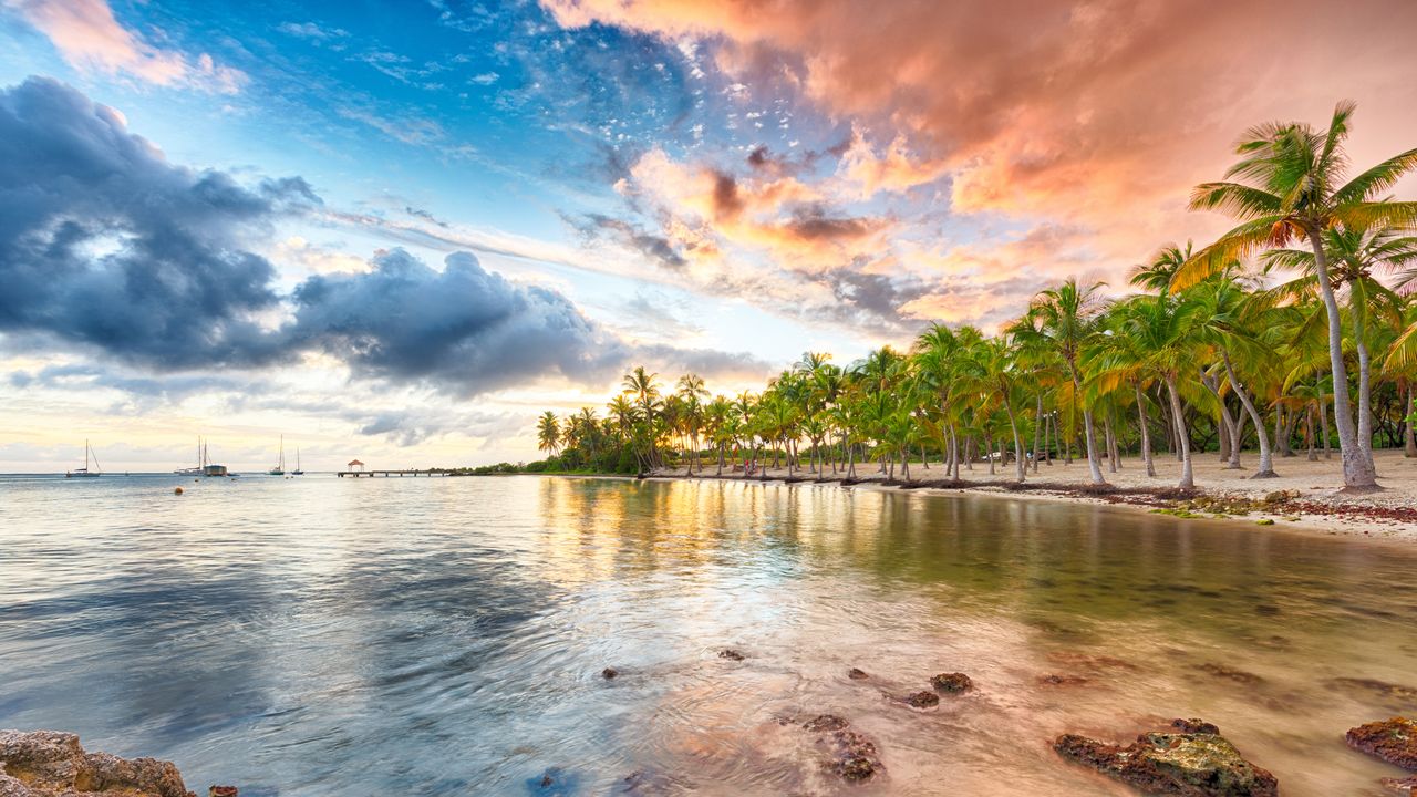 Sunset over Anse Champagne beach in Saint-François, Guadeloupe, Caribbean