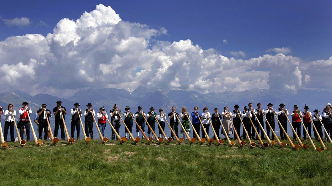 Alphorn musicians perform during the International Alphorn Festival in Nendaz, Switzerland
