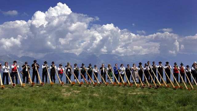 Alphorn musicians perform during the International Alphorn Festival in Nendaz, Switzerland