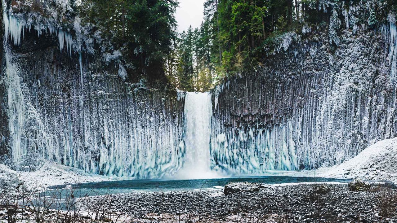 Frozen amphitheater of columnar basalt walls flanking Abiqua Falls, Oregon
