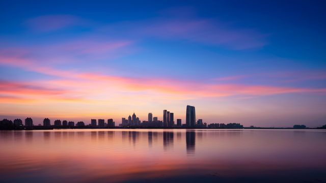 Skyscrapers reflected at sunset, Jinji Lake, Suzhou, China
