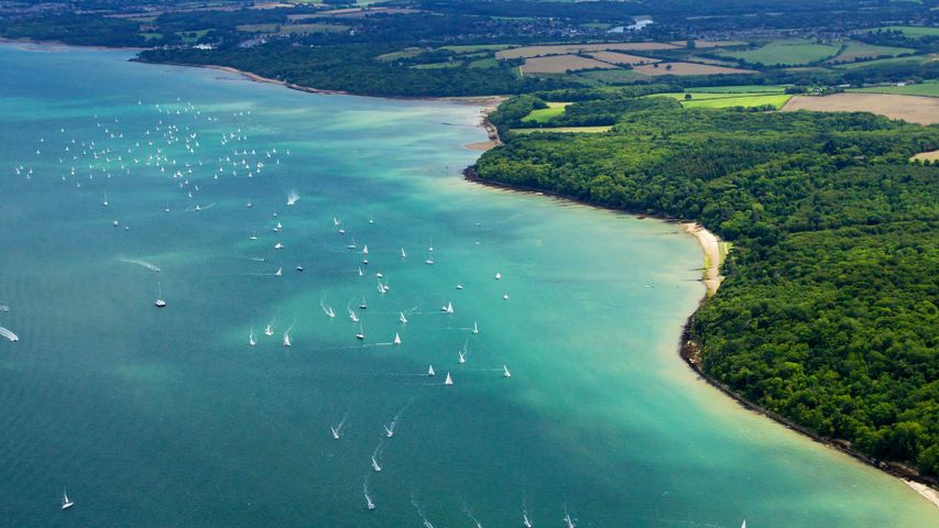 Aerial photo of yachts racing in Cowes Week on the Solent, Isle of Wight, Hampshire