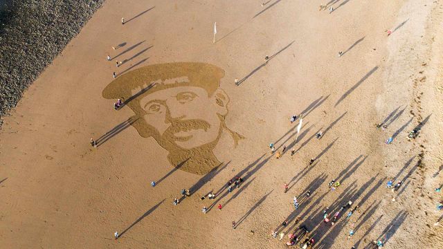 Sand portrait of WW1 Royal Naval Reservist Richard Davies on Ynyslas Beach, Ceredigion