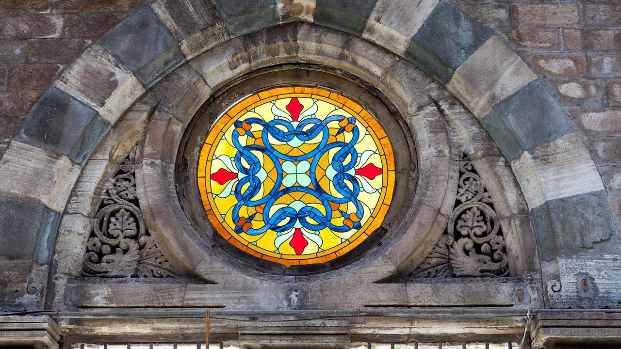 Colourful stained-glass window at the CST railway station (earlier Victoria Terminus), Mumbai