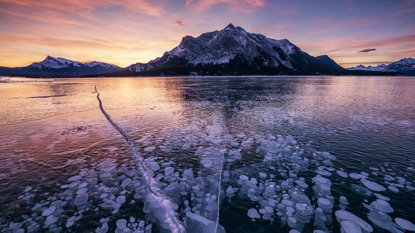 Mount Michener and a frozen Abraham Lake in Alberta, Canada