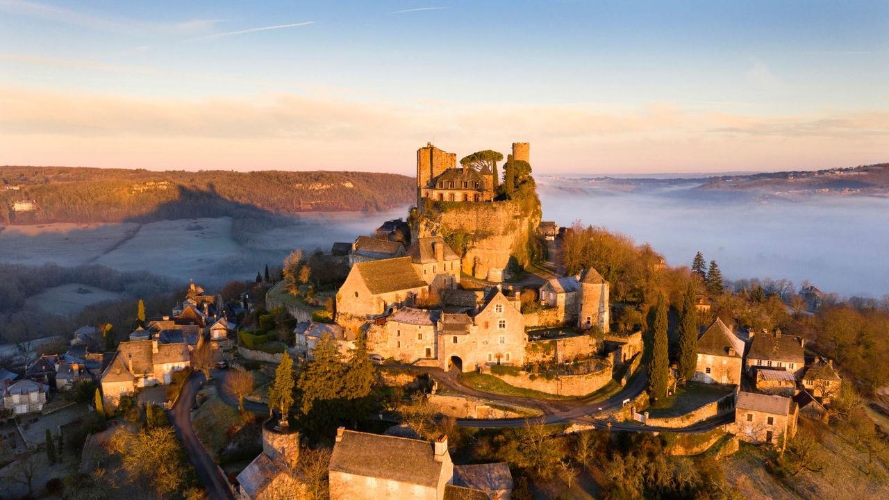 The hilltop village of Turenne at sunrise in the Corrèze department, Nouvelle-Aquitaine, France