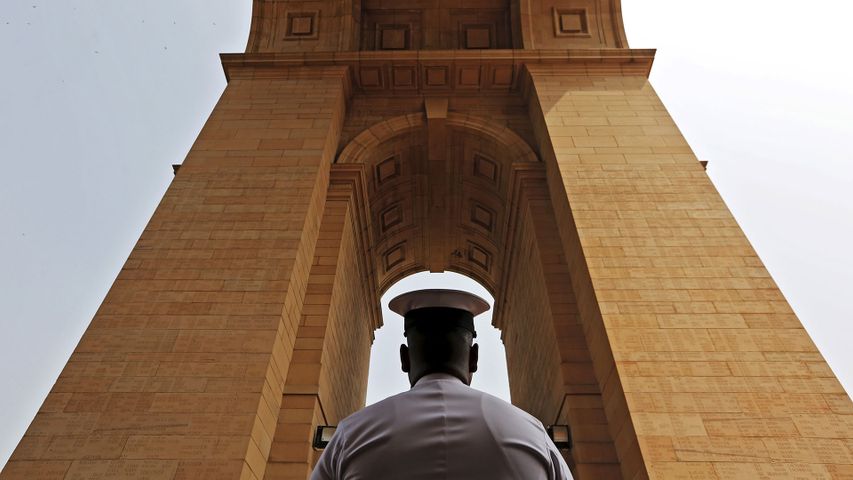 A naval soldier pays respect at India Gate War Memorial, Delhi.