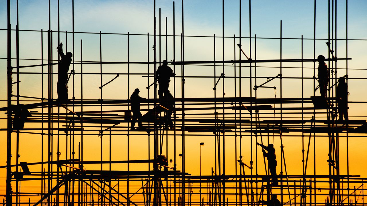 Construction workers on scaffolding