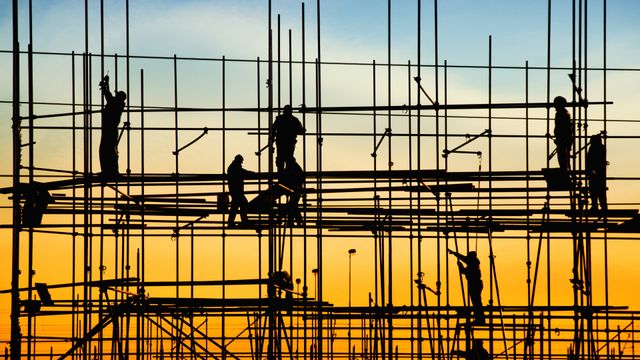 Construction workers on scaffolding