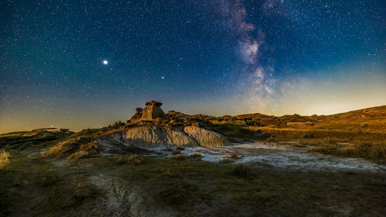 Summer Milky Way over the badlands formations at Dinosaur Provincial Park, Alberta, Canada