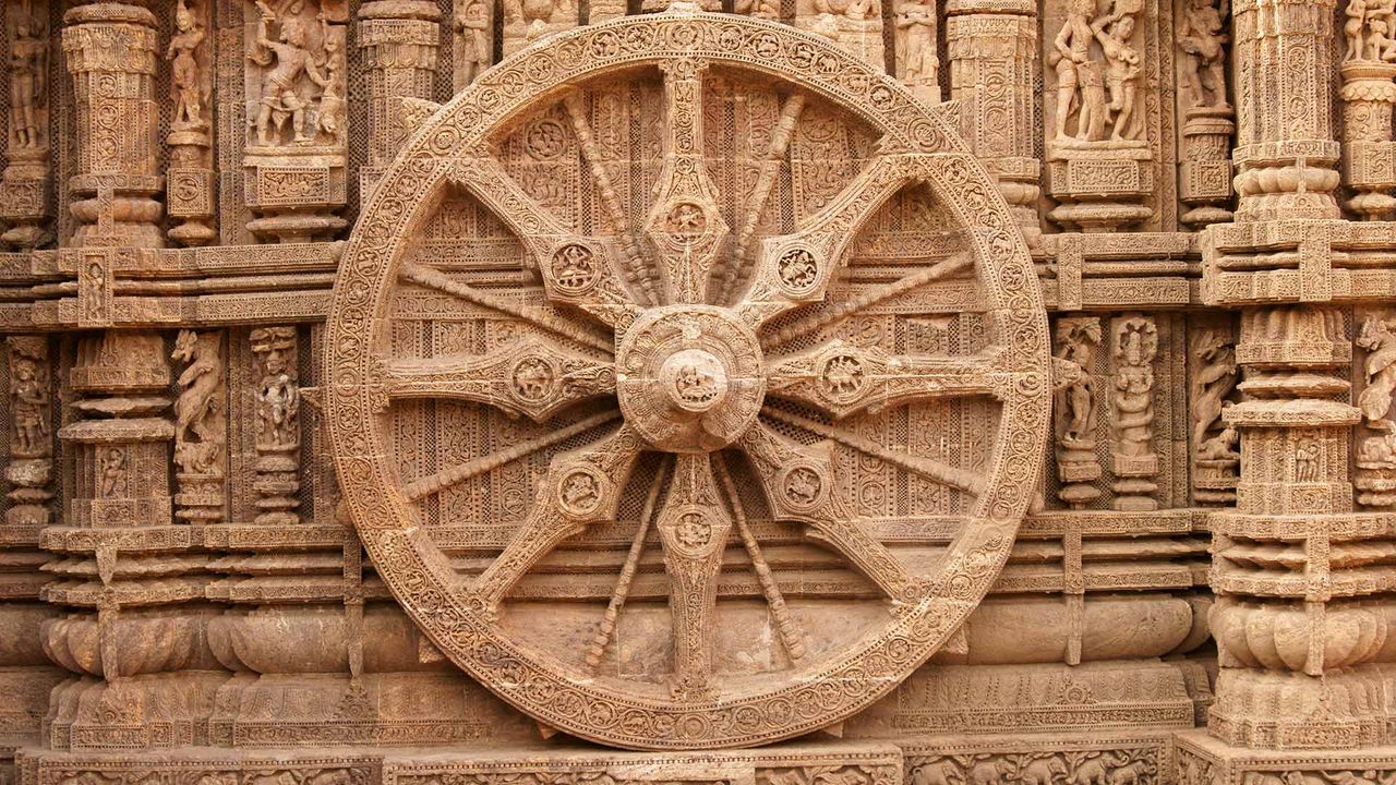 A stone wheel engraved in the walls of the Konarak Sun Temple in Orissa, India
