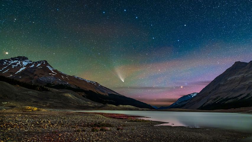 Comet NEOWISE streaks across the sky over Sunwapta Lake in Jasper National Park, Alberta