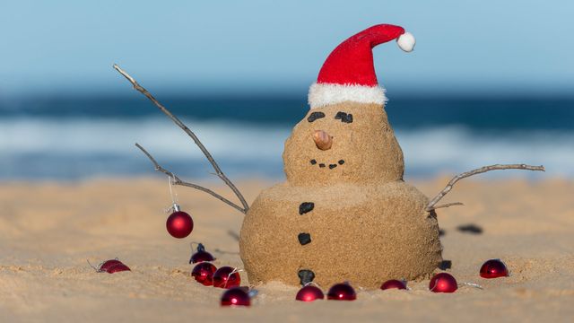 Australian Christmas sandman with decorations on Bondi Beach, NSW