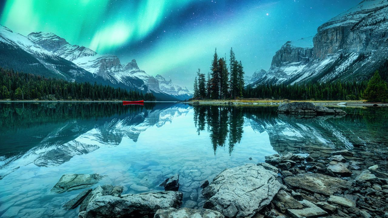 Green Aurora Borealis, Snow-capped Mountains, Lake Reflection, Red Canoe, Spirit Island, Maligne Lake, Jasper National Park, Alberta, Canada