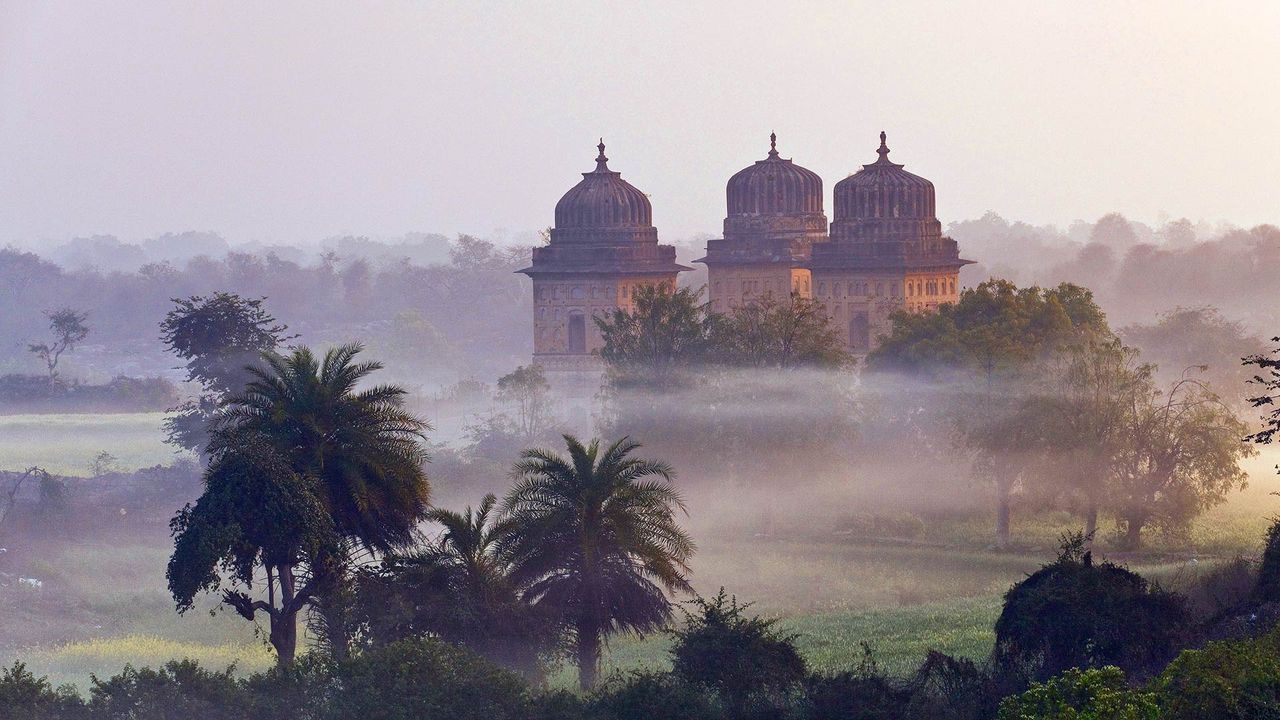 Orchha Palace on a misty morning at sunrise