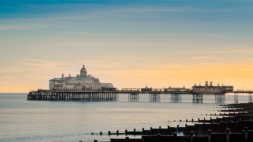 View along the beach to Eastbourne Pier, Eastbourne, East Sussex.