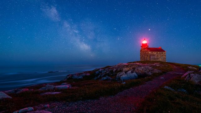 An old lighthouse under the starry sky in Rose Blanche, Nfld.