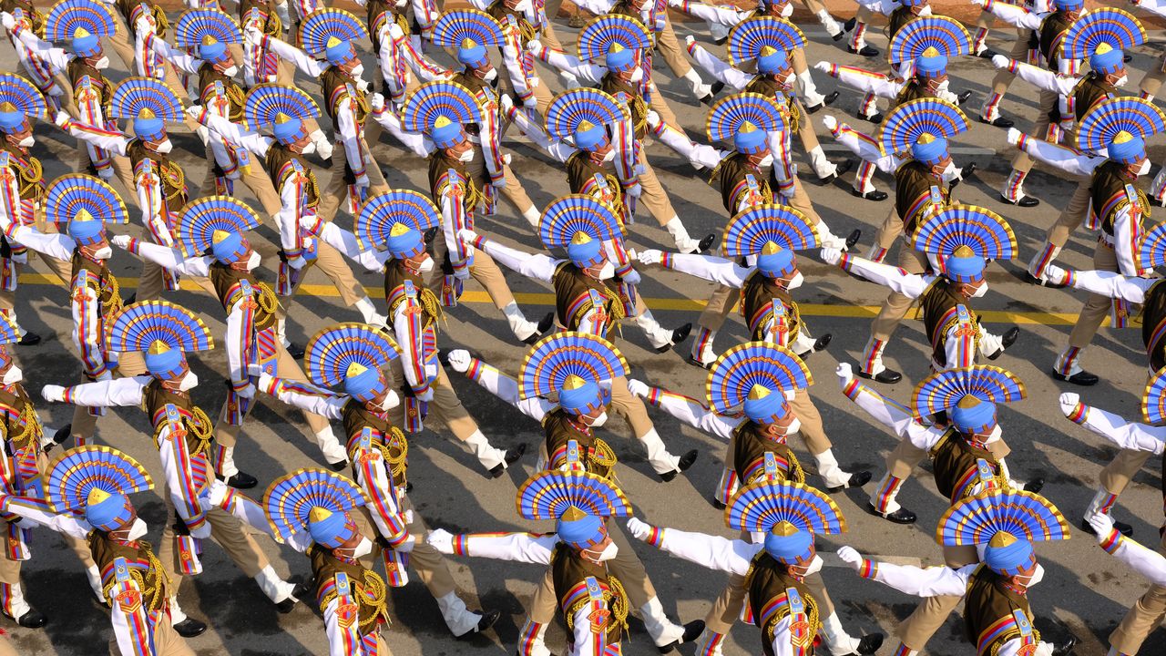 Indian Army soldiers march through the ceremonial Rajpath in New Delhi