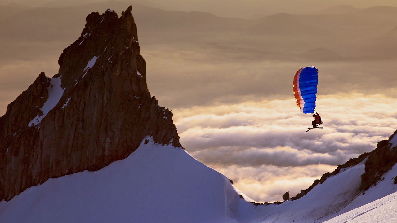 Backcountry adventurer Alex Peterson speed riding on the south side of Mount Hood, Oregon, USA