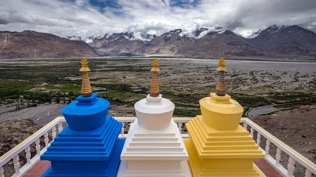 Three stupa with Nubra Valley in the background in Ladakh, India