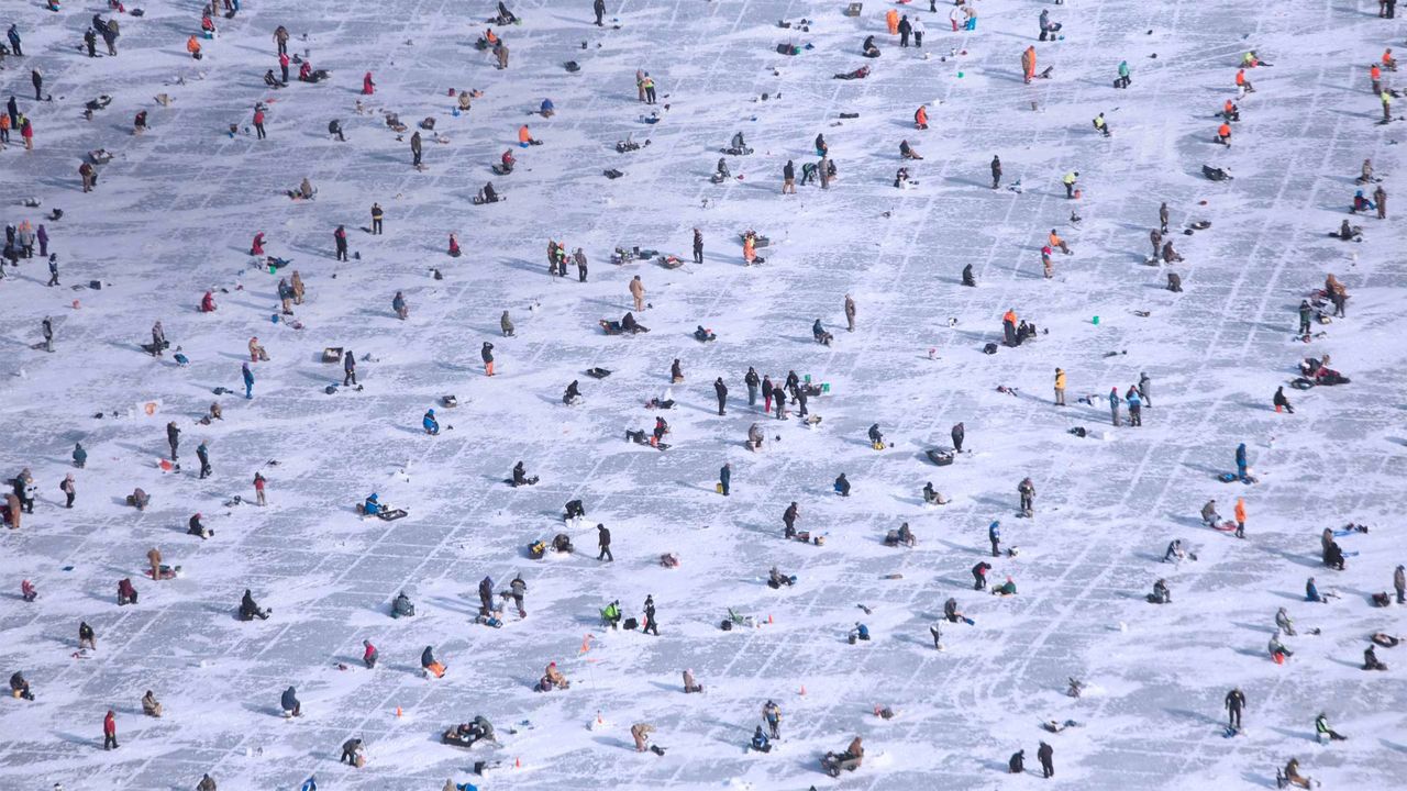 People ice fishing on Gull Lake in Brainerd, Minnesota, USA