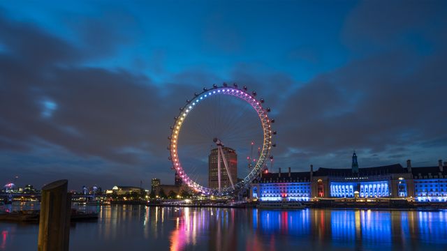 London Eye illuminated at dawn, England